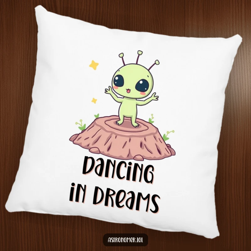 Funny pillow featuring a surprised alien creature doing a silly dance on a crater, offering comfort and cosmic amusement.