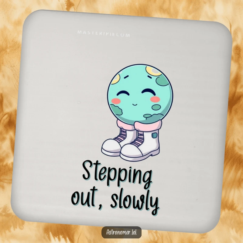 Funny winking planet trying to wear oversized moon boots, humorous coaster for drinks, space-themed table protection.