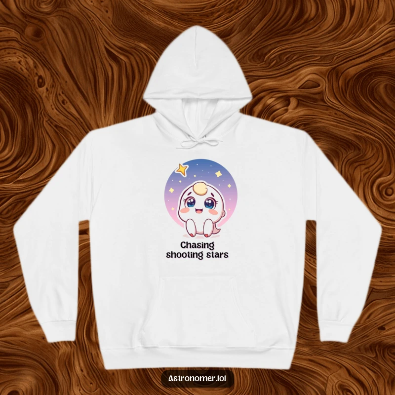 Funny hoodie with a joyful character gazing upwards with wide eyes at a spectacular shooting star, evoking feelings of hope and wonder.