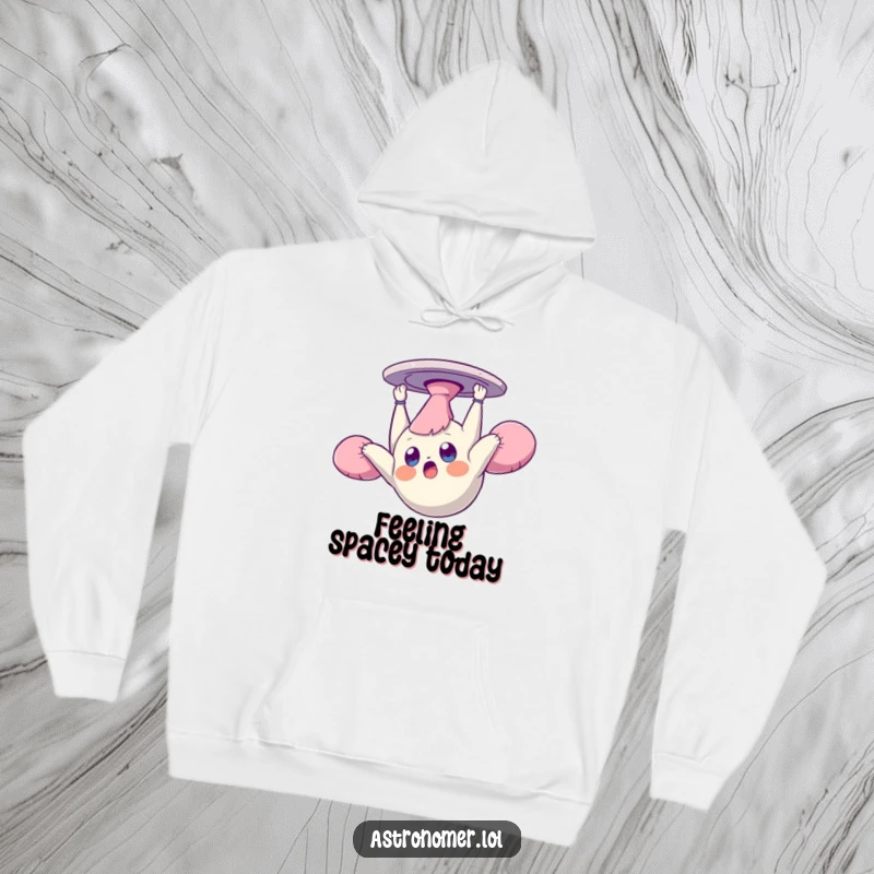 Funny hoodie showcasing a surprised creature floating upside down and dazed in zero gravity, offering warmth and quirky humor.