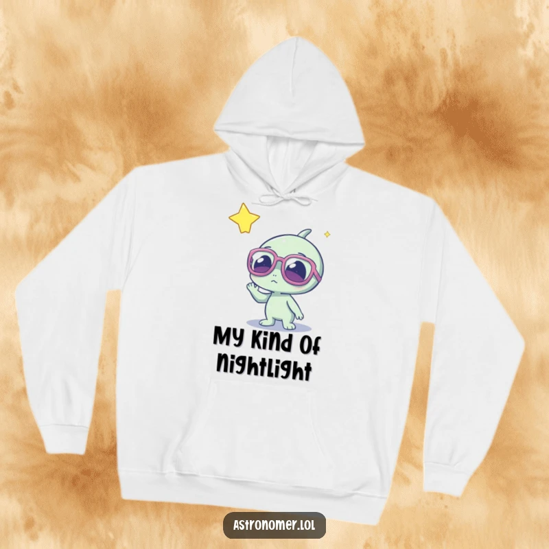 Funny alien character in oversized glasses, gazing at a distant glowing star, cozy hoodie designed for space lovers.