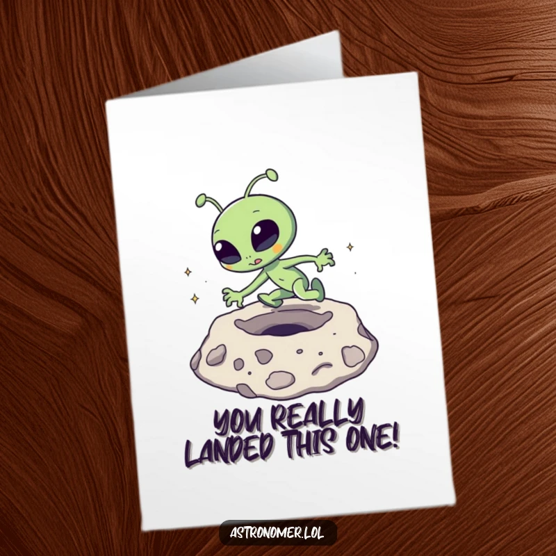 Free Printable Congratulations Card: A goofy alien comically tripping and stumbling over a prominent moon crater.