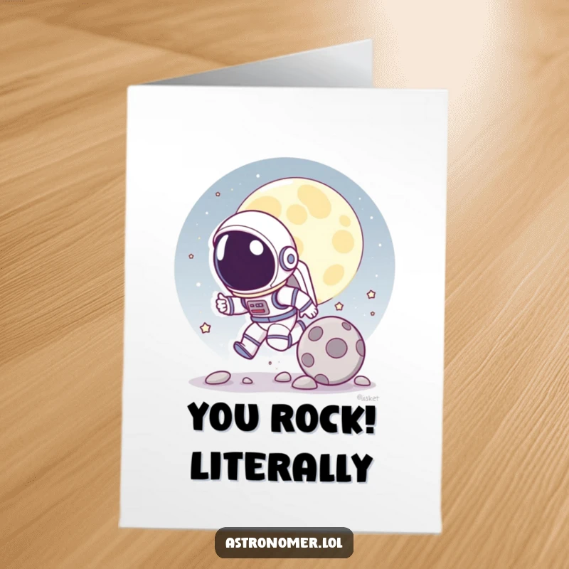 Funny Free Printable Congratulations Card: Cartoon astronaut playfully chasing a rolling moon rock, energetic celebration.