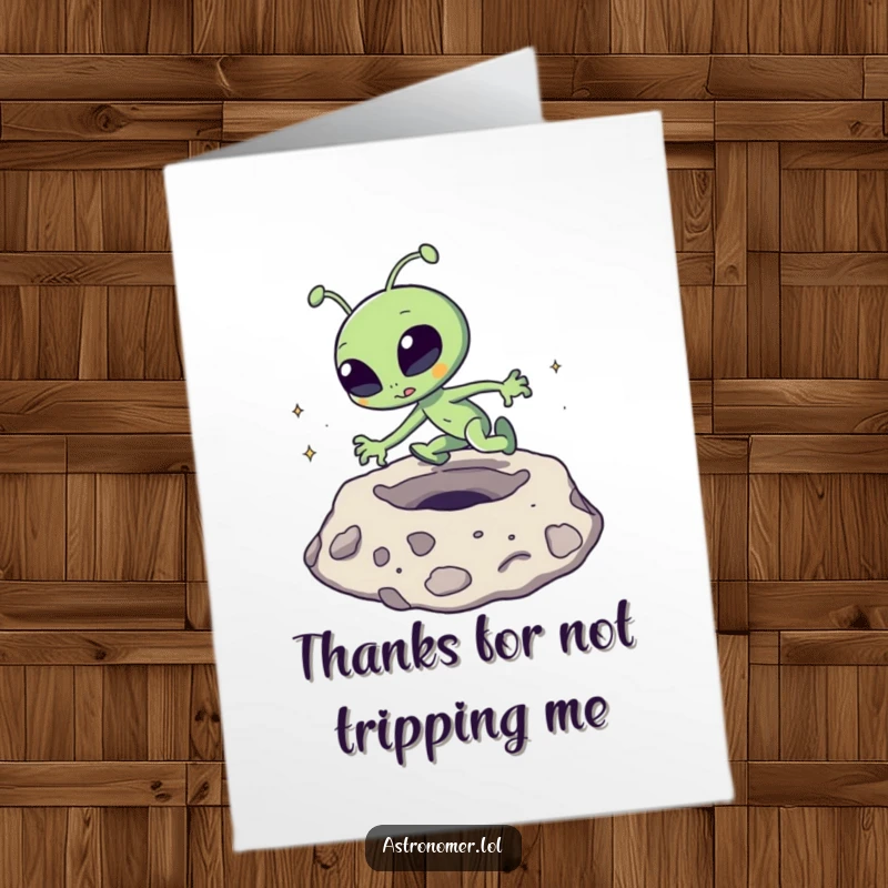 Funny Free Printable Thank You Card: A goofy alien comically tripping while navigating a moon crater, with a surprised expression.