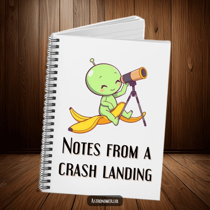 Funny alien slipping on a banana peel while looking through a telescope, humorous notebook for writing, space-themed jotter.